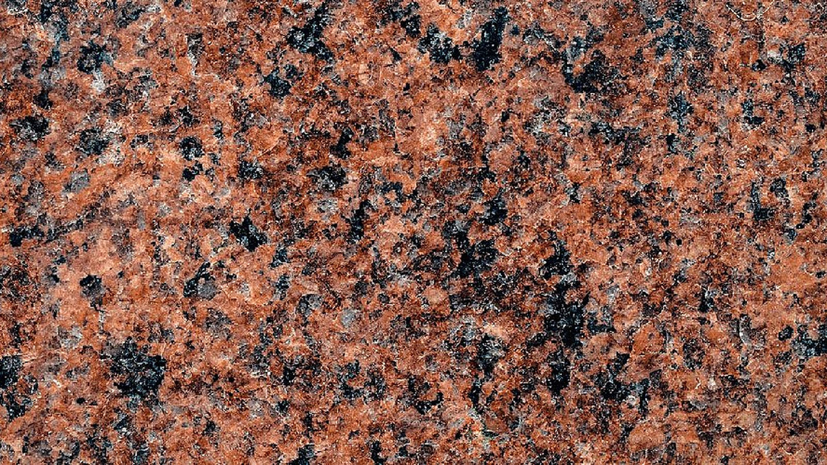 Close-up of red and black speckled granite