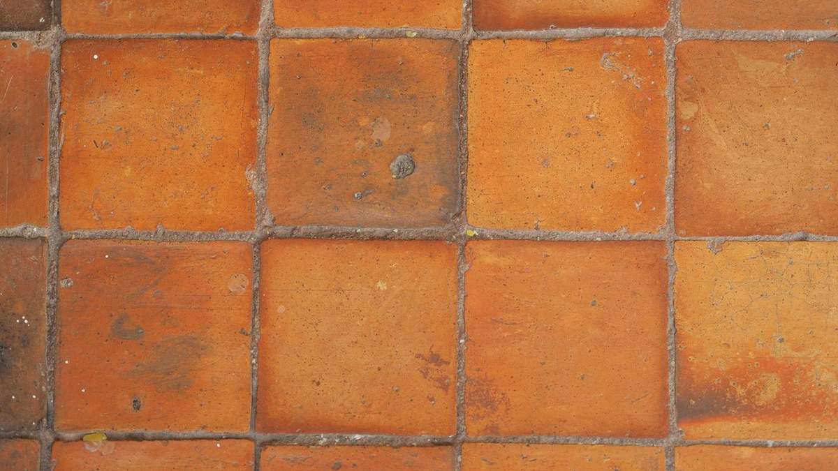 Terracotta tile floor in warm orange tones